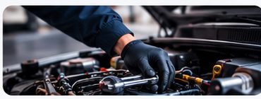 Mechanic working on a car engine
